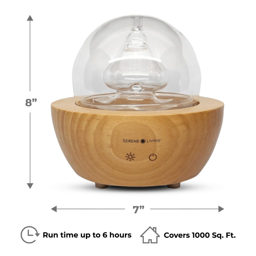 Fountain diffuser is crafted from hand blown glass and sustainably sourced wood for a stylish